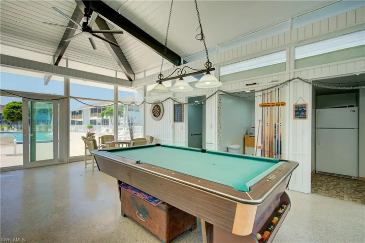 Recreation room featuring pool table, a ceiling fan, and beam ceiling