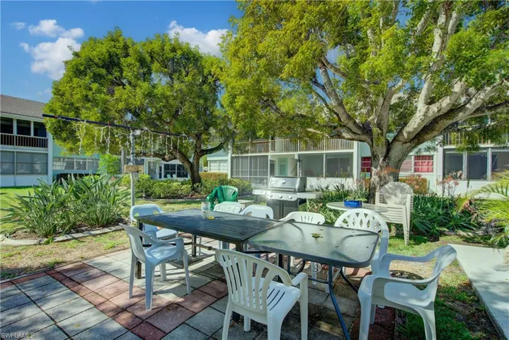 View of patio terrace outdoor dining area, and a grill