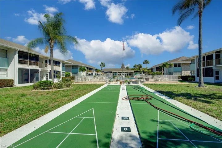View of property's community with shuffleboard