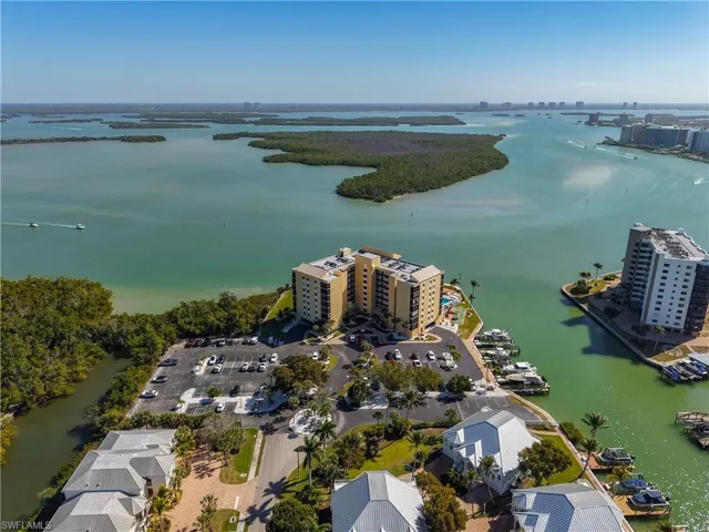 Bird's eye view of a nearby body of water and apartment complex