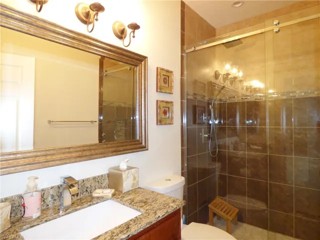 Upgraded Guest Bathroom with an enclosed shower, and vanity