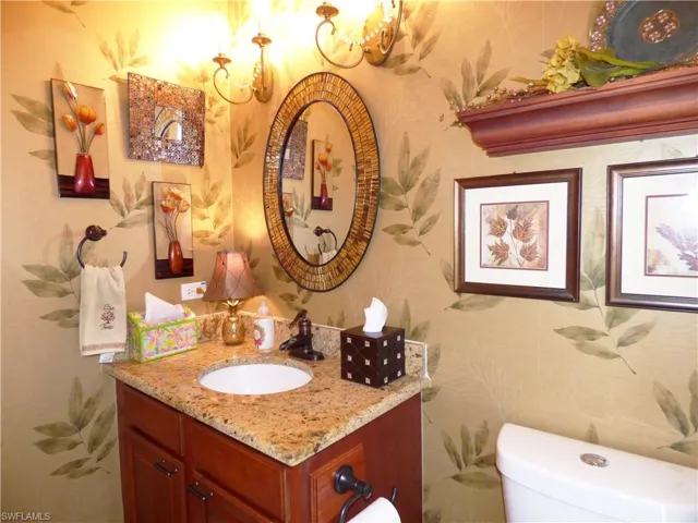 Bathroom featuring granite counter,