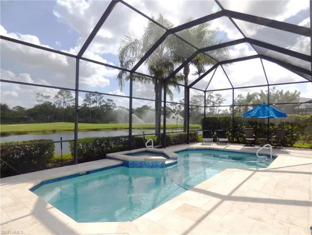 View of salt water swimming pool and in ground hot tub.