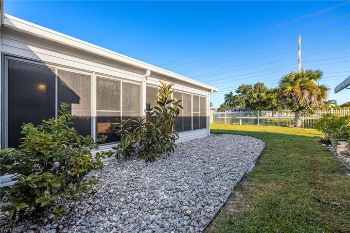 View of yard with a sunroom