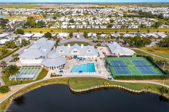 Aerial view of a pool and a large body of water