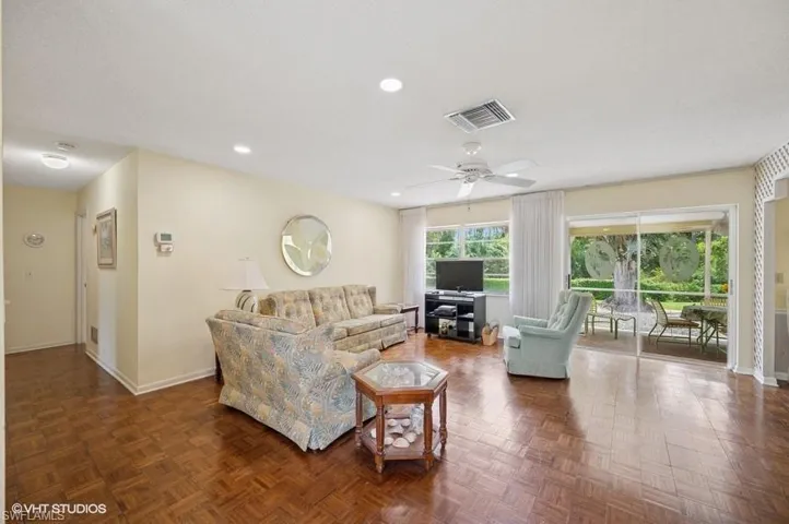 Living room with recessed lighting, baseboards, a textured ceiling, ceiling fan, and visible vents