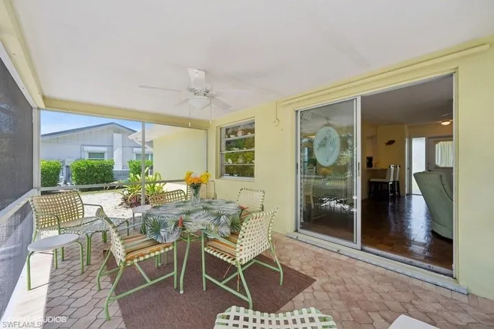 Screened Patio with outdoor dining area and ceiling fan