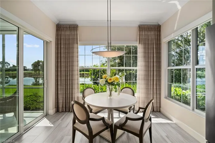 Sunroom with a water view
