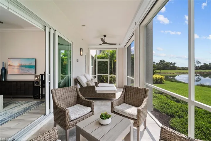 Sunroom / solarium with a water view