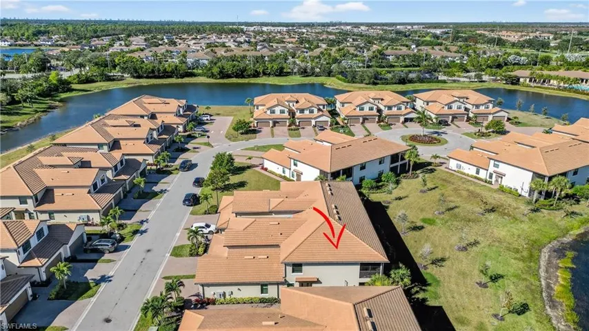 Aerial perspective of suburban area with a large body of water