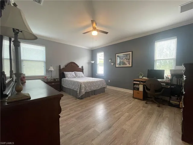 Master bedroom featuring wood-type flooring