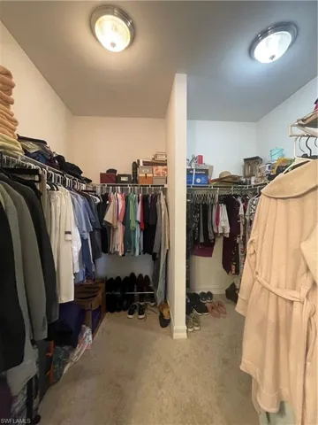 Walk in closet separate his and her sides