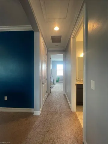 Hallway to guest bathroom and guest bedroom 2