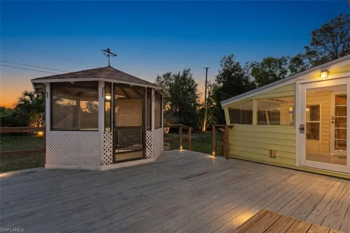 Deck at dusk with a sunroom