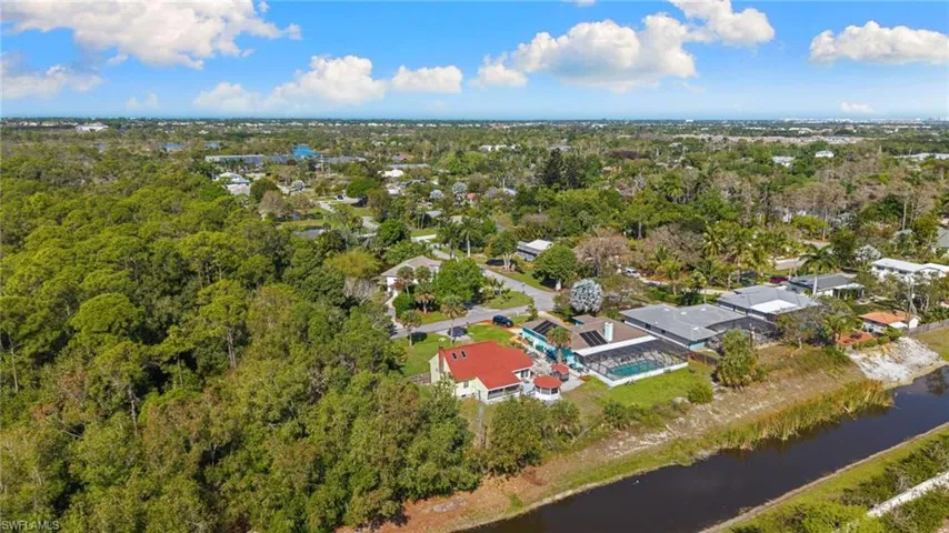 Aerial perspective of suburban area with a tree filled landscape