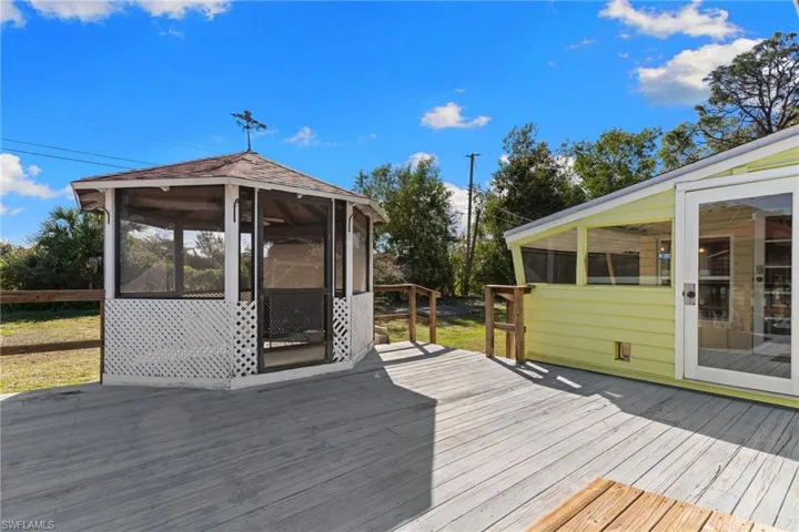 Deck featuring a sunroom