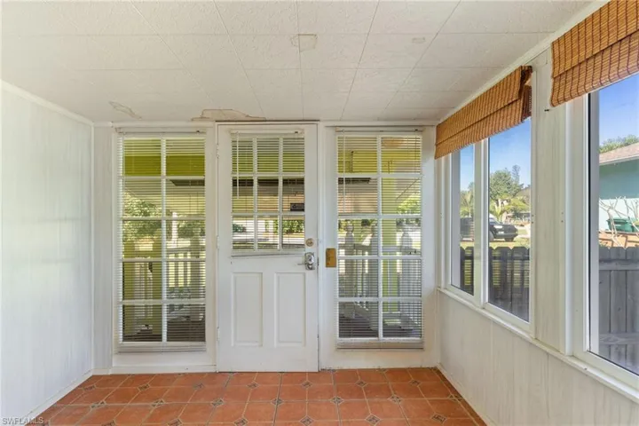Unfurnished sunroom with plenty of natural light
