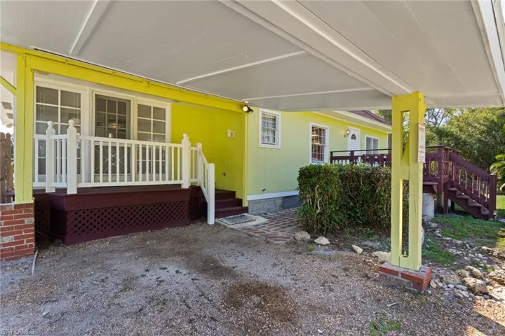 Doorway to property with a wooden deck