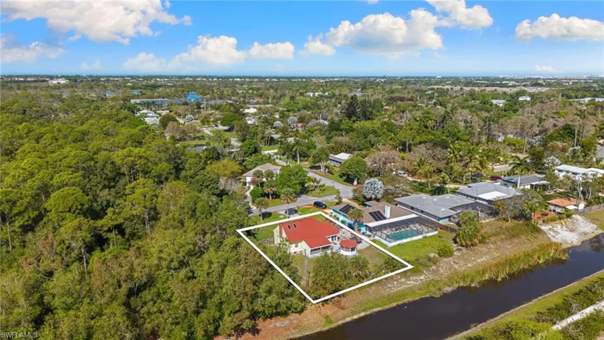 Aerial perspective of suburban area featuring property parcel outlined