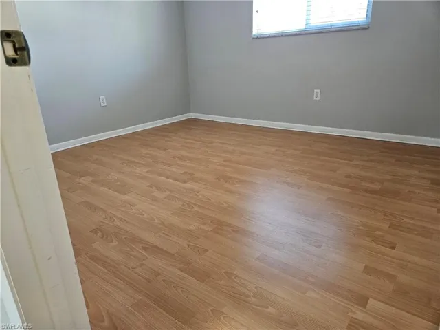 Unfurnished room with light hardwood / wood-style floors