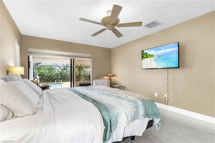 Bedroom with access to outside and ceiling fan