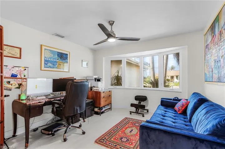 Home office featuring a ceiling fan