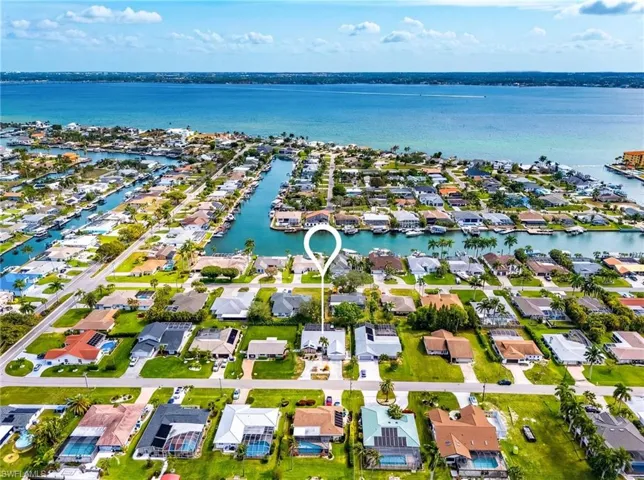 Aerial perspective of suburban area with a large body of water
