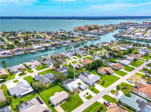 View of property location with nearby suburban area and a large body of water