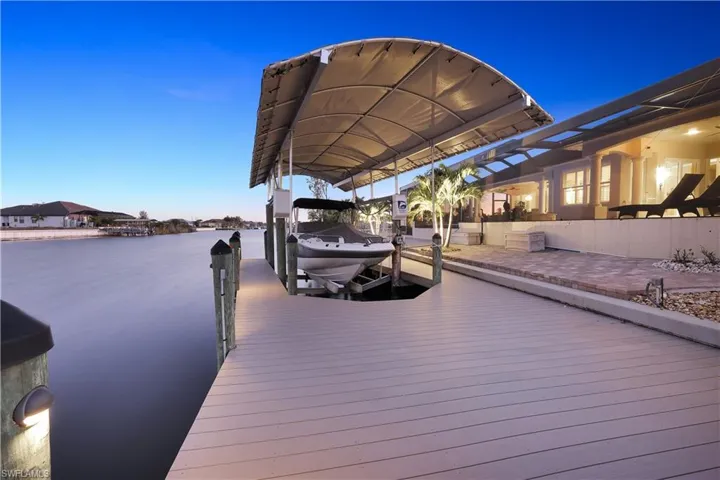 Dock with boat lift and a water view