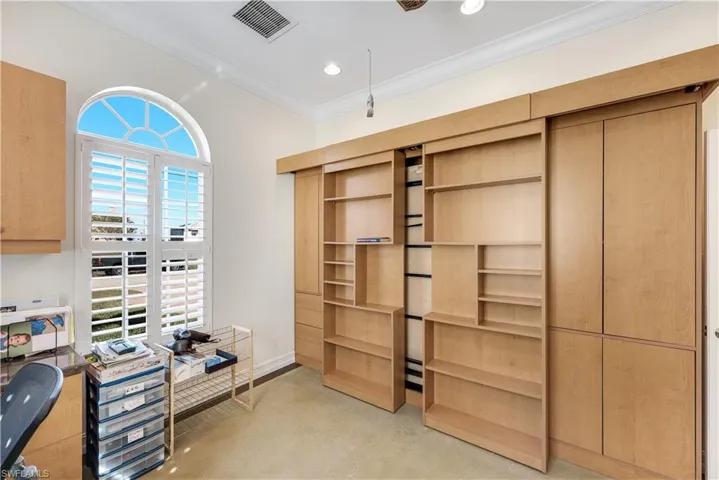 Office space featuring finished concrete floors, ornamental molding, and recessed lighting