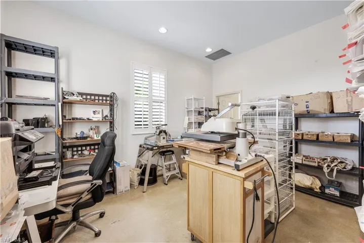 Home office featuring concrete flooring and recessed lighting