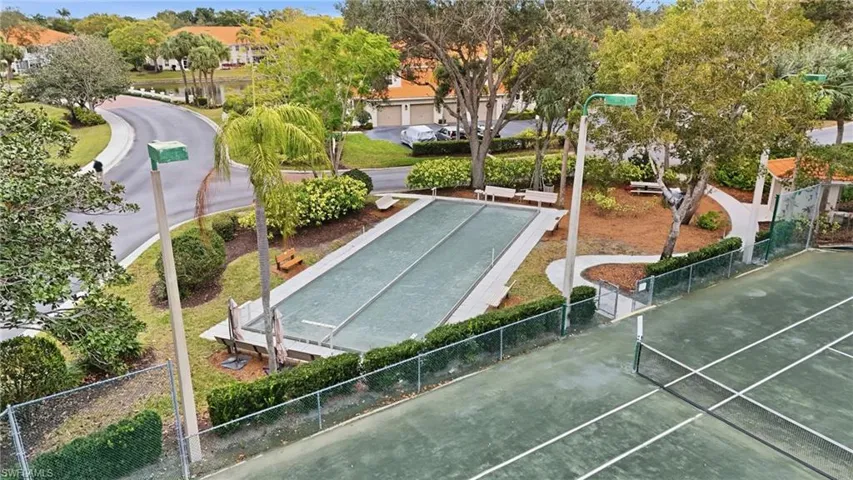 View of property's community featuring a bocce ball area and tennis courts