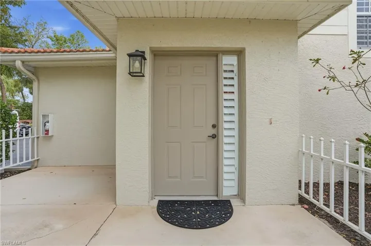 Doorway to property with private patio area
