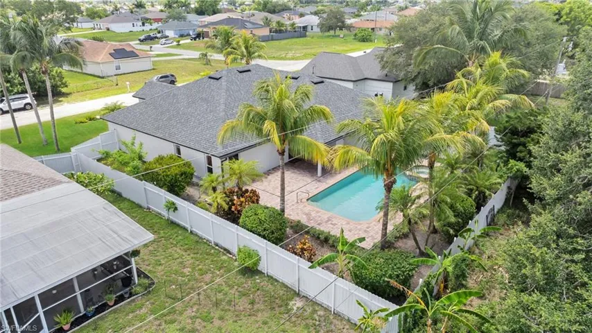 Aerial perspective of suburban area featuring a pool area