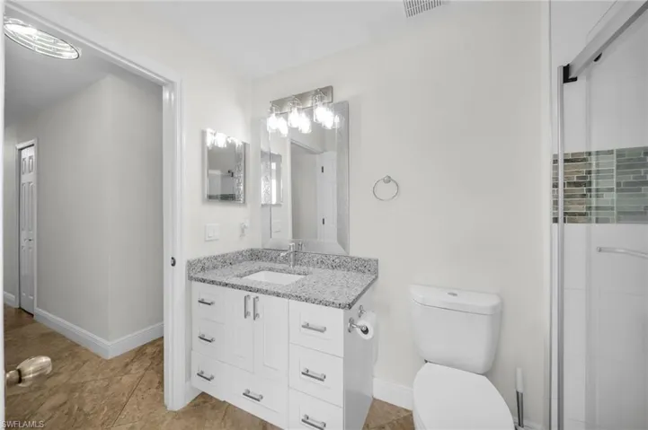 Full bathroom f'eaturing vanity and / toilet\