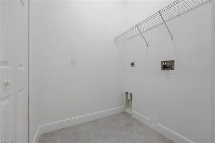 Laundry room with washer hookup and hookup for an electric dryer