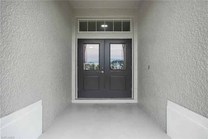 Doorway to property with brand new doors.