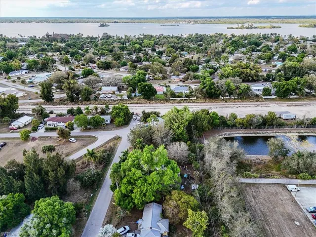 Aerial view of residential area featuring a large body of water