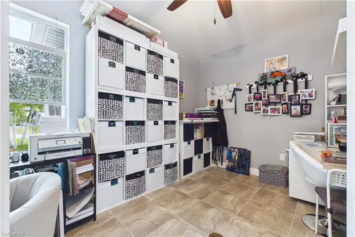 Currently used for owner's craft hobbies, this space is a private office or could be used as a 4th bedroom.