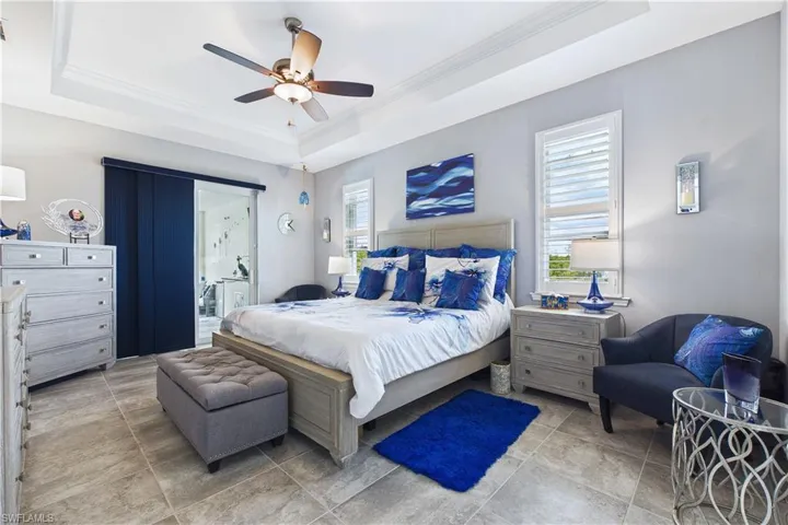 Large primary bedroom adjoins lanai.