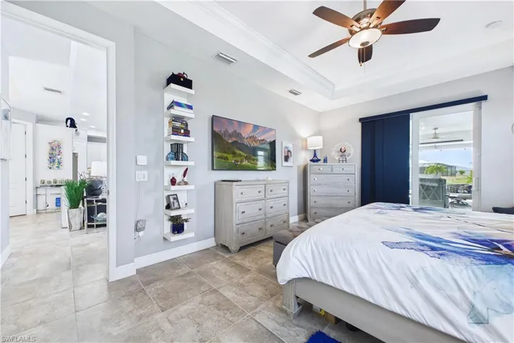 Large primary bedroom adjoins lanai.