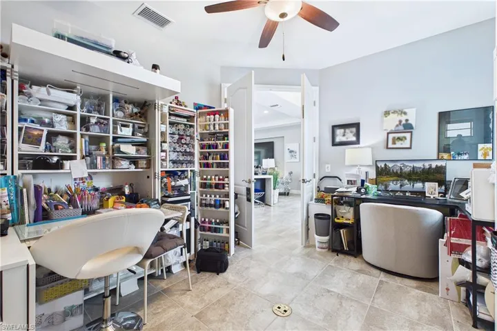 Currently used for owner's craft hobbies, this space is a private office or could be used as a 4th bedroom.