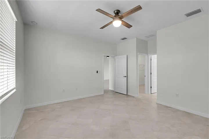 Primary bedroom overlooks lake
