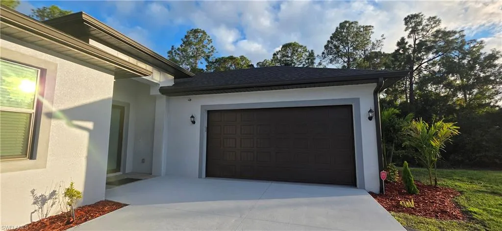 Garage featuring driveway
