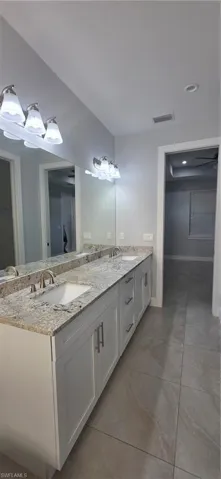 Bathroom featuring double vanity