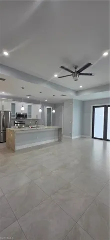 Unfurnished living room with recessed lighting and ceiling fan