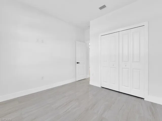 Unfurnished bedroom with a closet