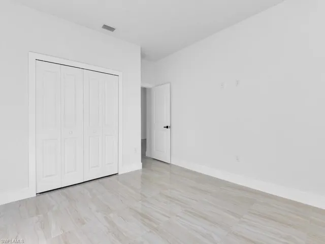 Unfurnished bedroom with a closet