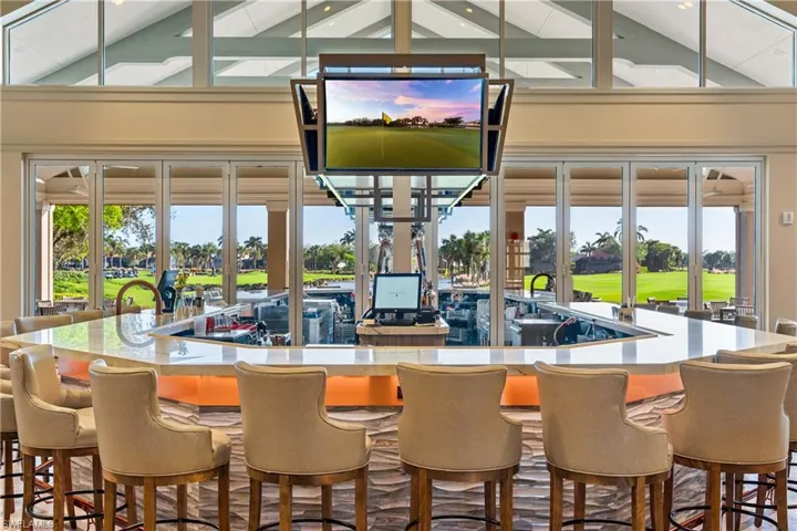 Bar area with beam ceiling and high vaulted ceiling