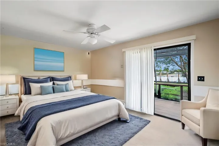 Bedroom upstairs with balcony.